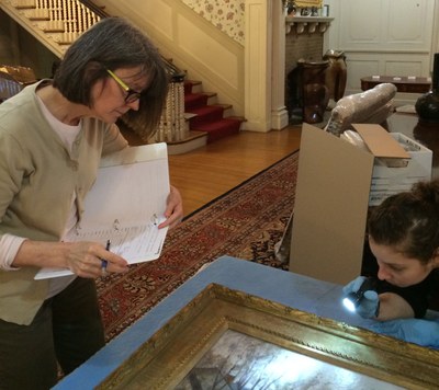 Conservators examine painting